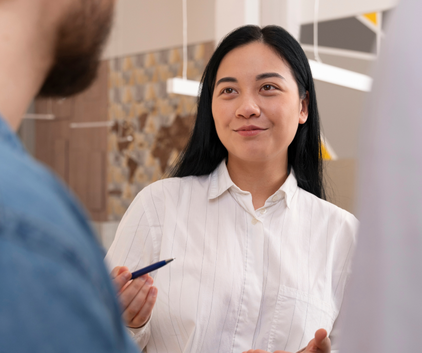 A client mid-conversation with a consultant across the counter